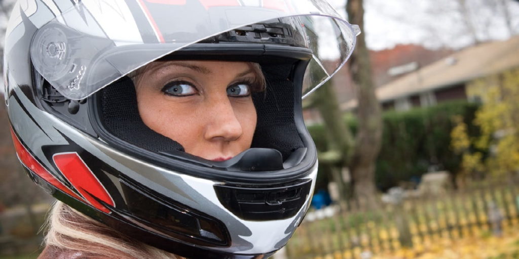 woman wearing motorcycle helmet
