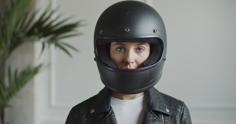 Woman wearing helmet indoors