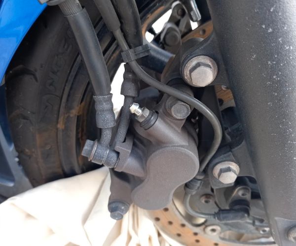 Front brake caliper bleed screw